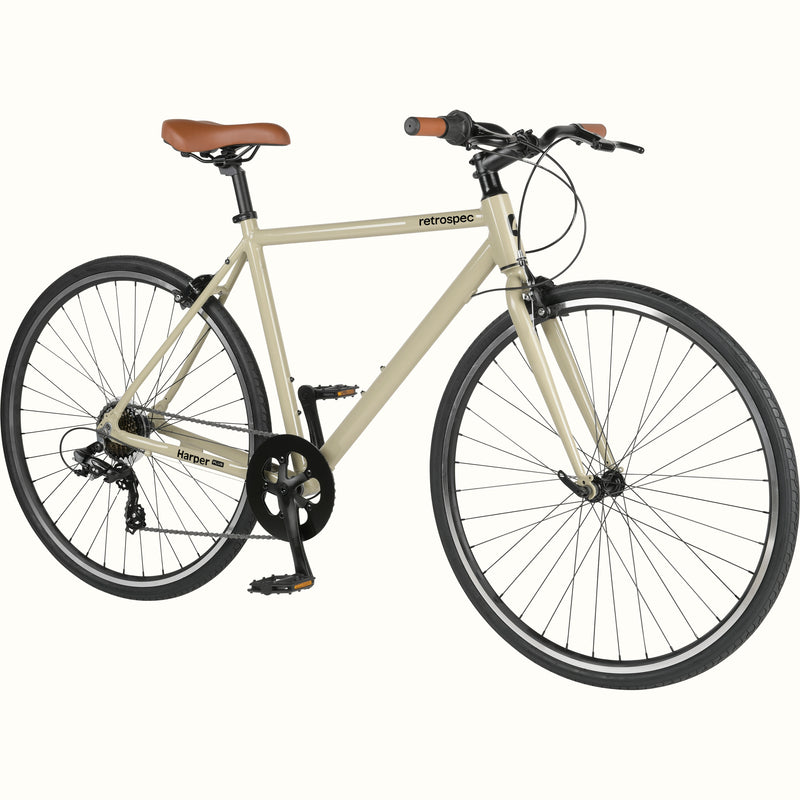 An cream-colored retrospec Harper Plus 7-Speed bicycle with brown saddle and handlebars.